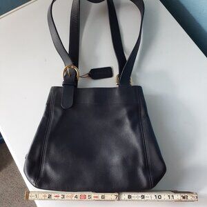 Womens black Coach shoulder bag w 2 straps, zippered part inside and snap close